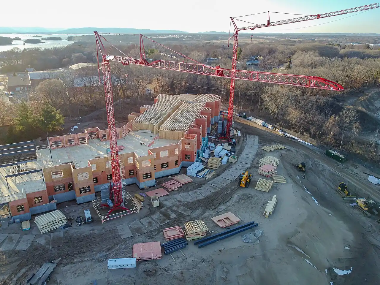 Aerial view of tower cranes over a multi-building construction site